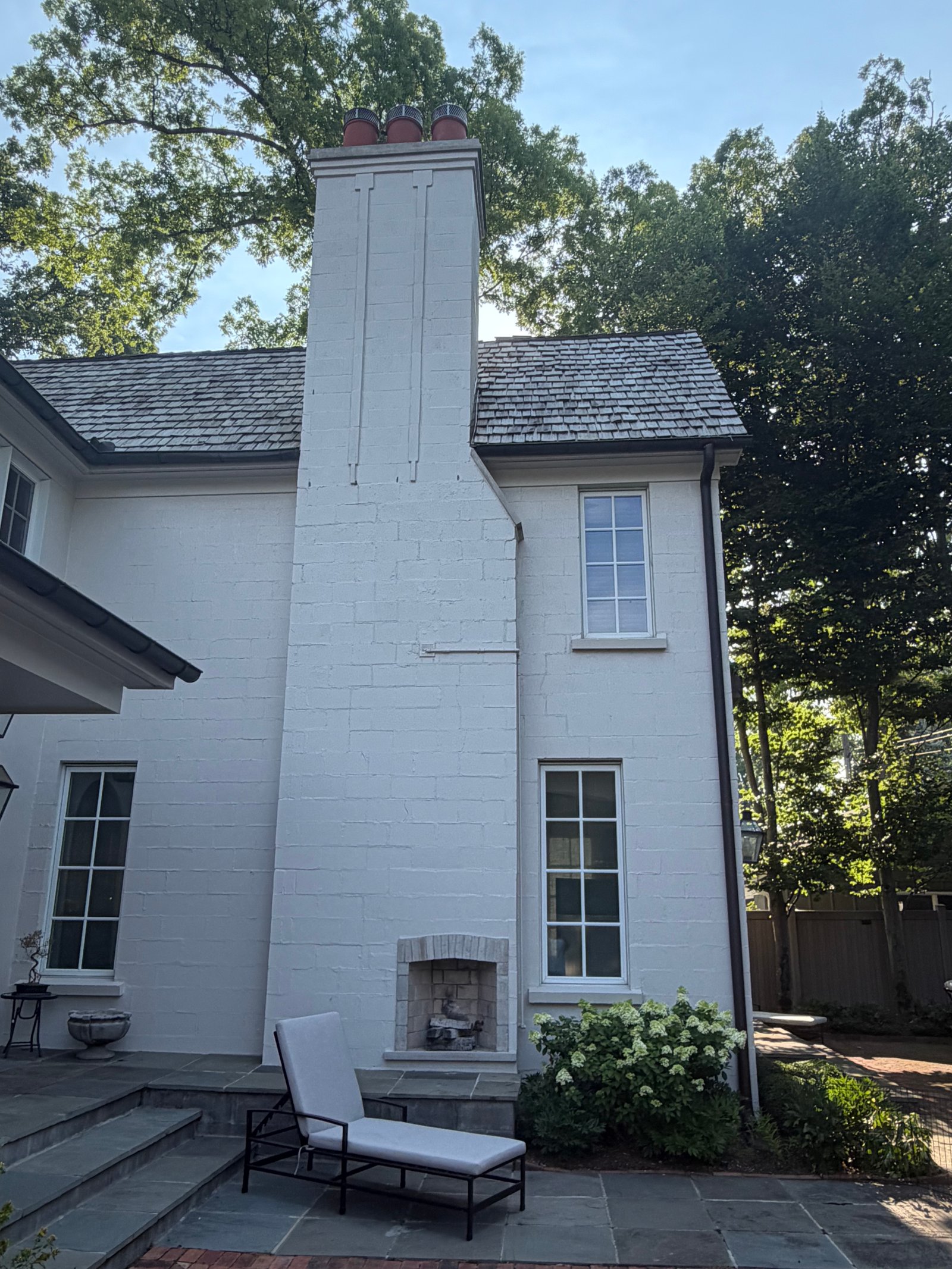 Completed chimney, luxury home with outdoor seating
